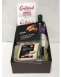 Delicious Spanish food gift package with olives, cheese and serrano ham.