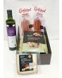 Delicious Spanish food gift package with olives, cheese and serrano ham.